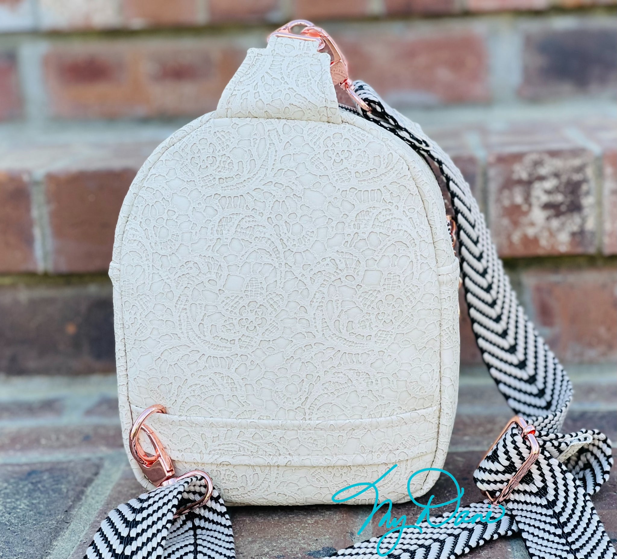 The MavPack Sling Bag in Off White Lace