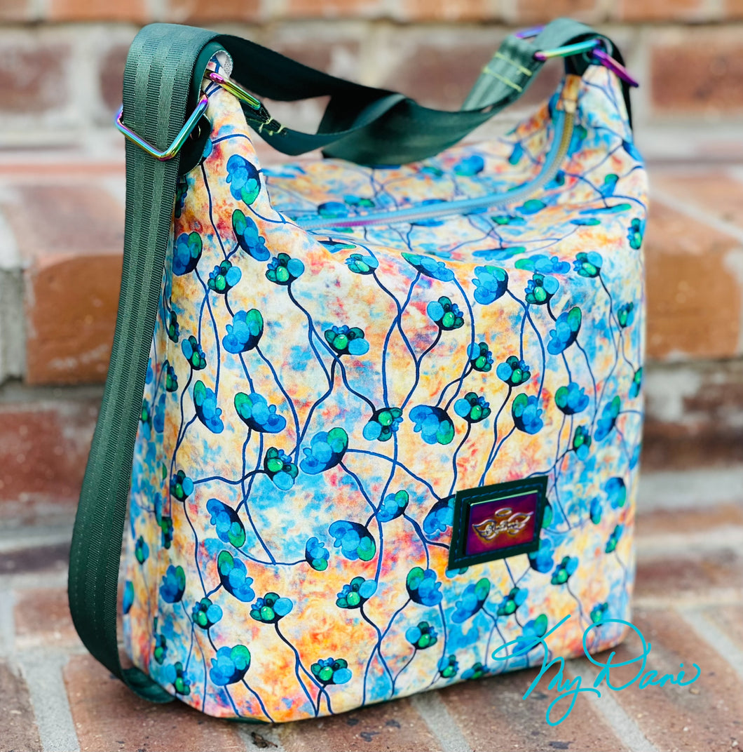 The Krystal Convertible Mini Handbag in Blue and Copper Floral