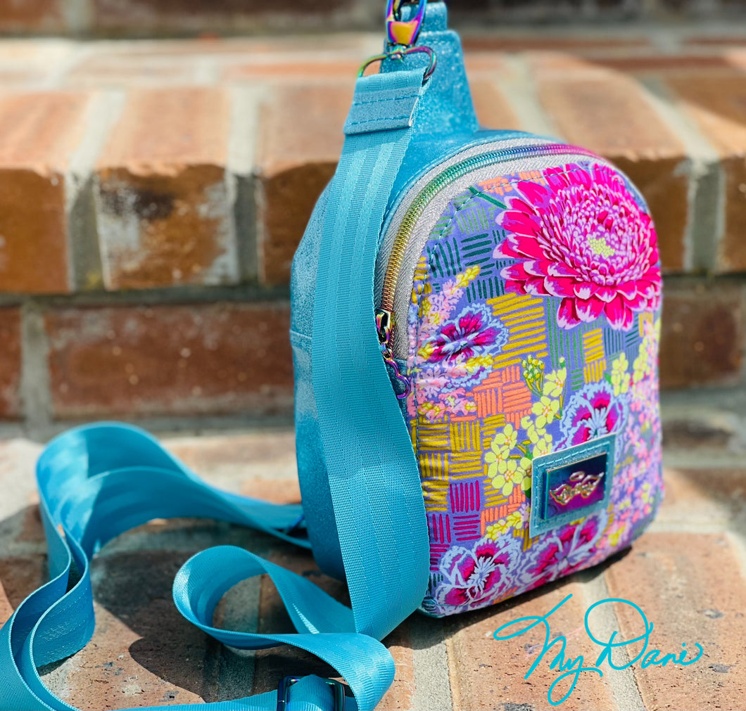 The MavPack in Turquoise Sparkle and bright Floral